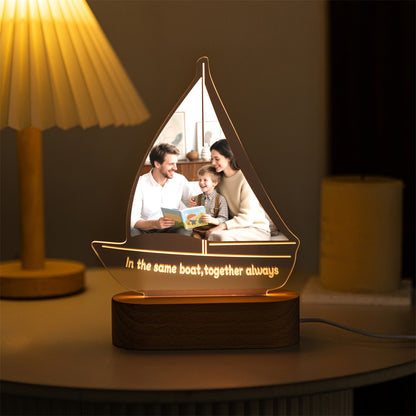 Custom sailboat-shaped acrylic light with family photo glowing warmly – MoeCraze